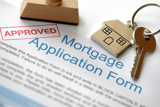 mortgage application form with the word approved stamped across the form
