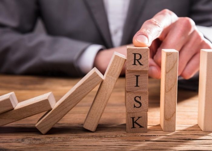An image of building blocks spelling out risk