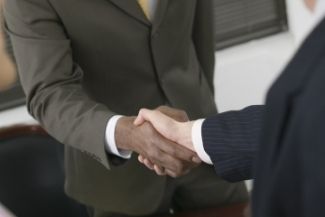 business handshake between two men