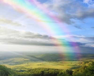 An image of a rainbow over fields