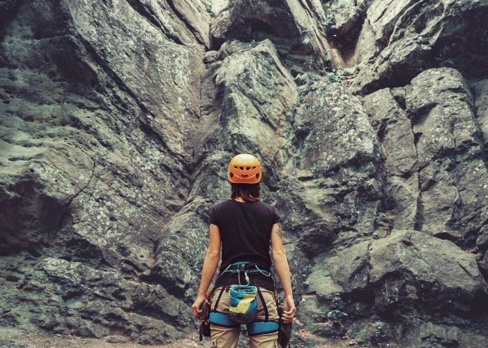 a woman about to do some rock climbing 