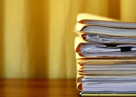 documents on a desk illustrating the importance of full disclosure